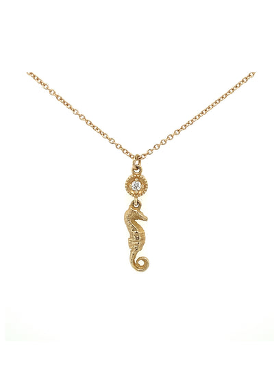 Seahorse charm necklace in 14k yellow gold and set with diamond